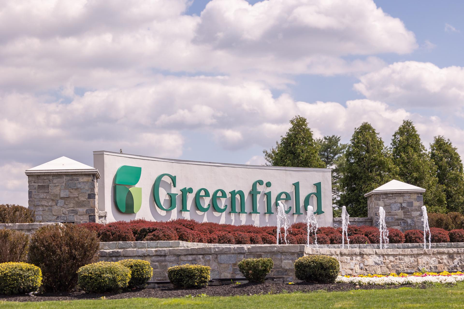 Greenfield sign with fountain 